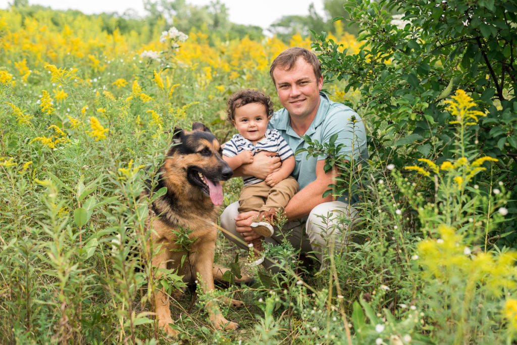 Family session for a dad and a toddler son and a dog at SongBird Slough Forest Preserve in Itasca by family photographer Mila Craila Photography