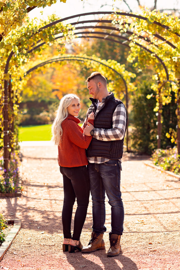 An engagement session for an engaged couple at Cantigny Park in Wheaton in the fall by a wedding photographer Mila Craila Photography