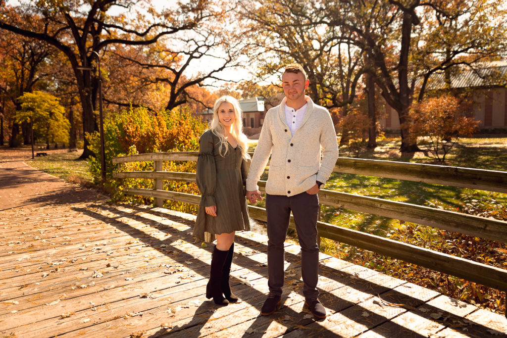 An engagement session for an engaged couple at the Buckingham Fountain in Chicago in the summer by a wedding photographer Mila Craila Photography