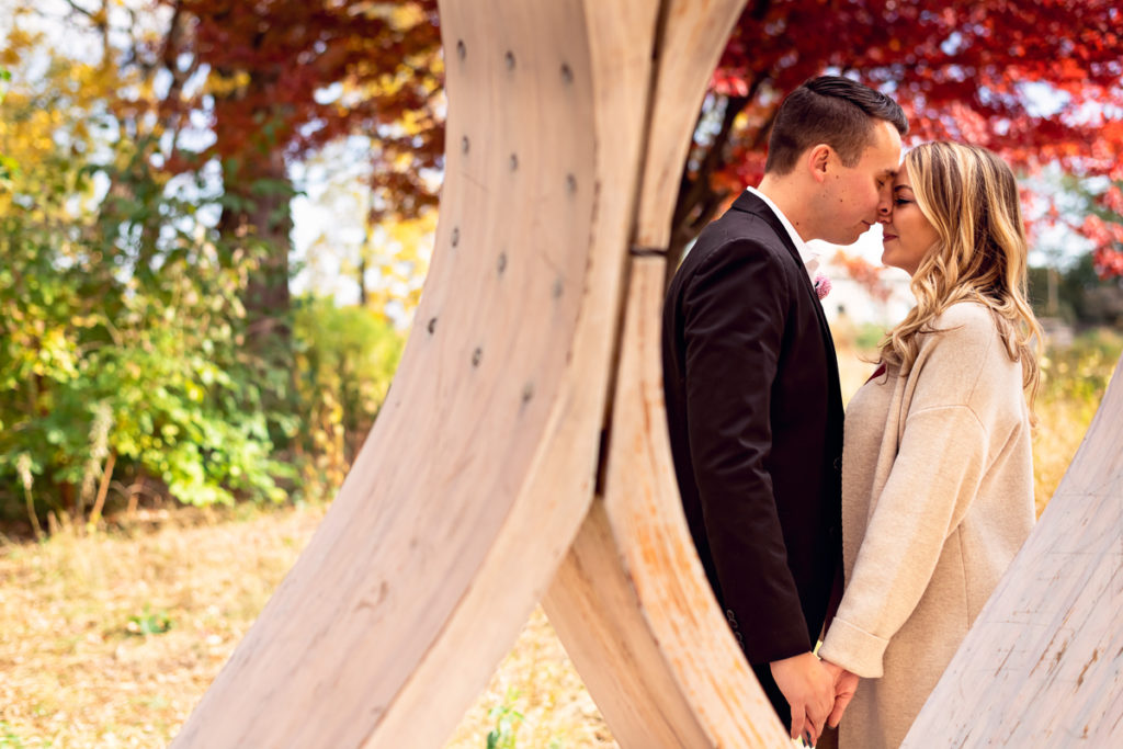 An engagement session for an engaged couple in Lincoln Park in the fall by a wedding photographer Mila Craila Photography