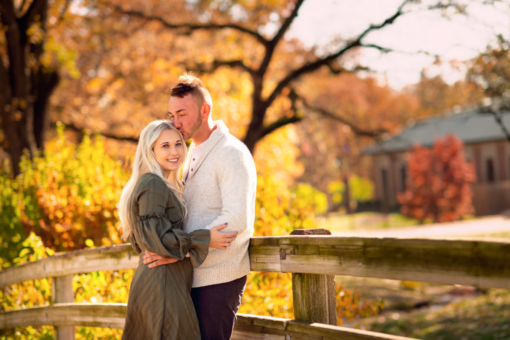 An engagement session for an engaged couple at the Buckingham Fountain in Chicago in the summer by a wedding photographer Mila Craila Photography