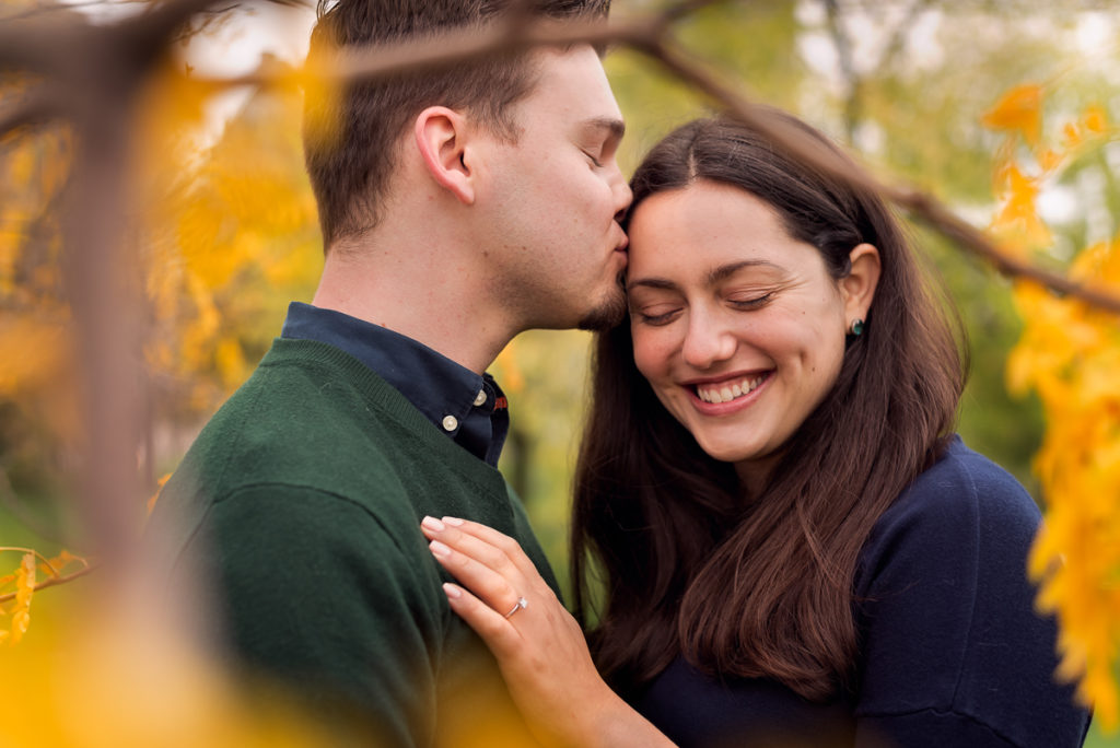 An engagement session for an engaged couple on North Avenue Beach in Chicago in the fall by a wedding photographer Mila Craila Photography