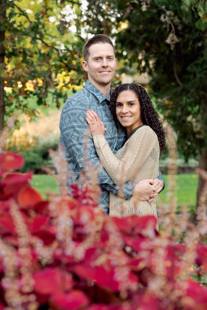 An engagement session for an engaged couple at Fabyan Forest Preserve in the fall by a wedding photographer Mila Craila Photography