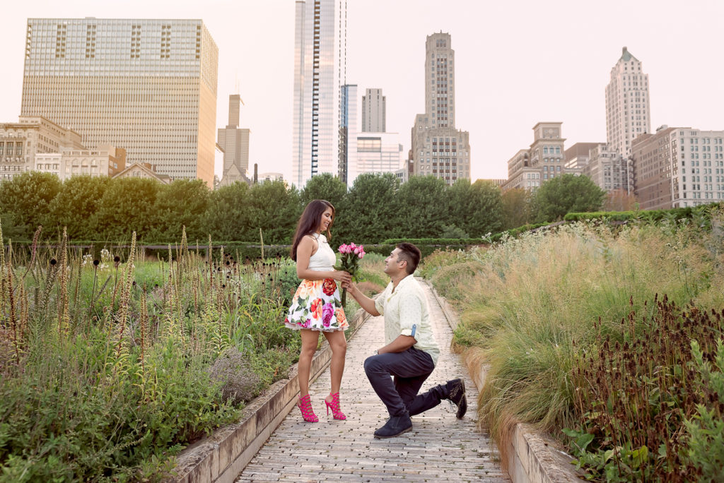 An engagement session for an engaged couple in Millennium Park in Chicago in the summer by a wedding photographer Mila Craila Photography