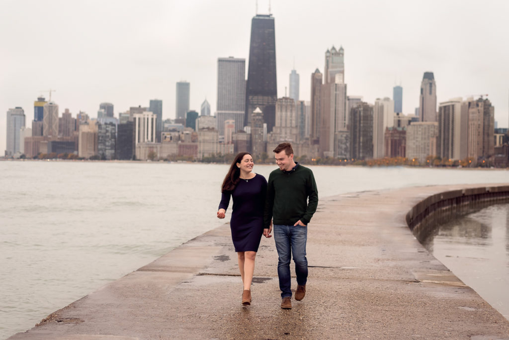 An engagement session for an engaged couple on North Avenue Beach in Chicago in the fall by a wedding photographer Mila Craila Photography