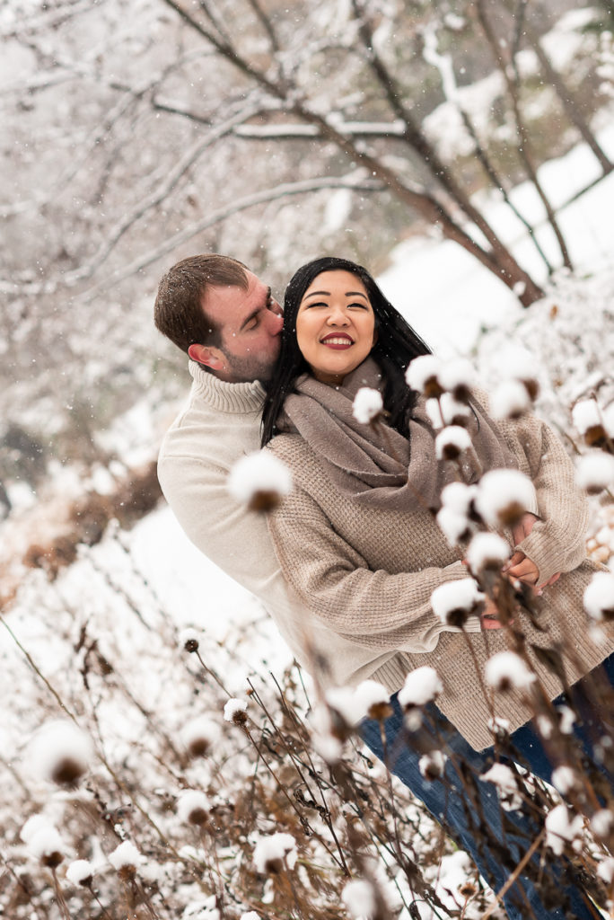 An engagement session for an engaged couple at Fabyan Forest Preserve in the winter by a wedding photographer Mila Craila Photography