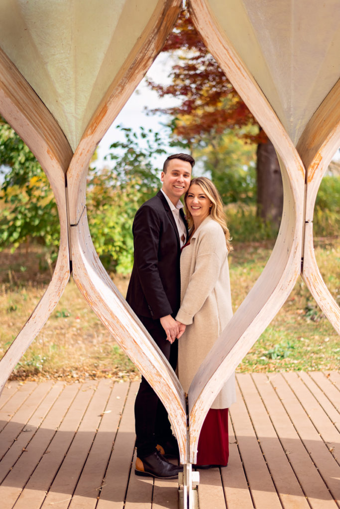 An engagement session for an engaged couple in Lincoln Park in the fall by a wedding photographer Mila Craila Photography