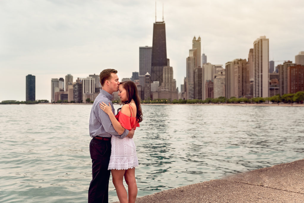 An engagement session for an engaged couple on North Avenue Beach in Chicago in the spring by a wedding photographer Mila Craila Photography