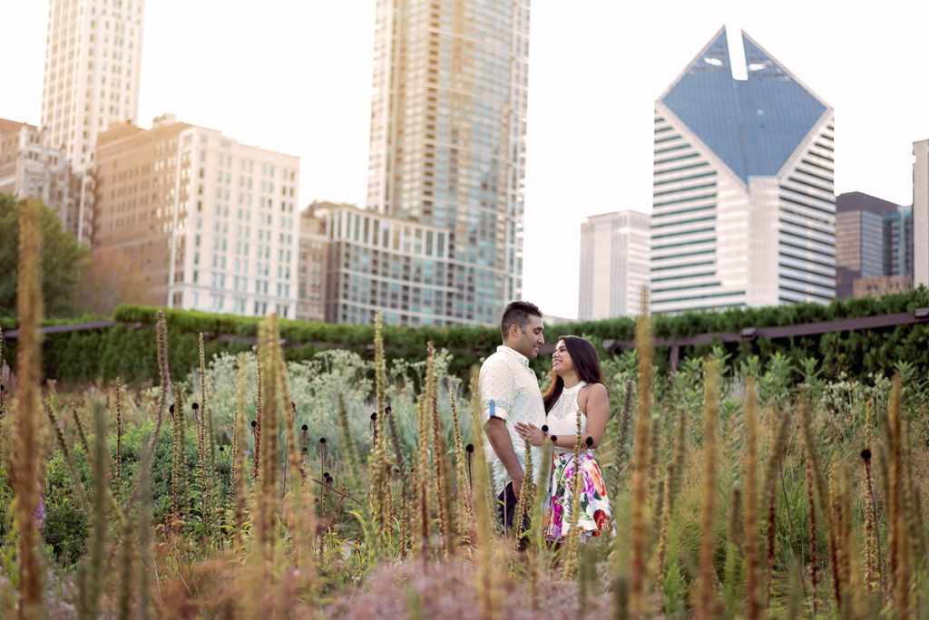 An engagement session for an engaged couple in Millennium Park in Chicago in the summer by a wedding photographer Mila Craila Photography