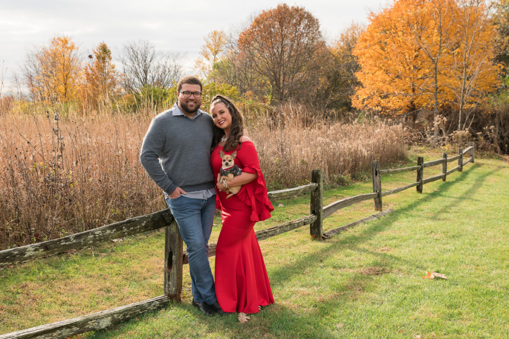 Family session for a couple with a dog at the park in Champaign, Illinois in the fall by family photographer Mila Craila Photography