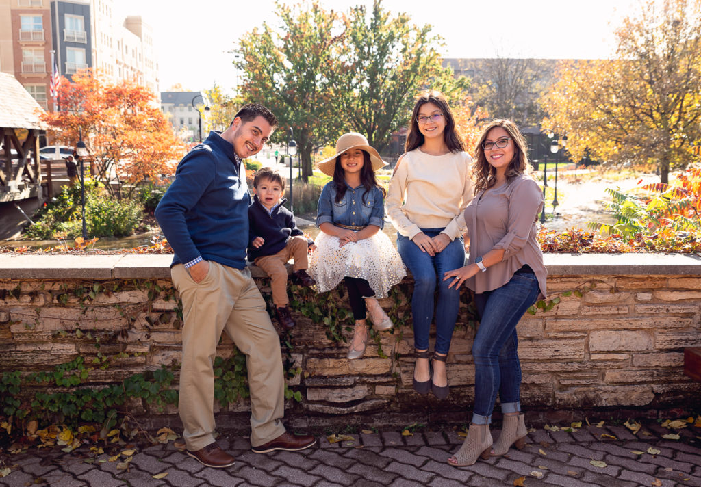 Family session for a family with three kids near the bridge on Naperville Riverwalk by family photographer Mila Craila Photography