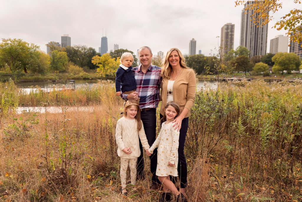 Family session for parents with three kids at Lincoln Park Zoo in Chicago in the fall by family photographer Mila Craila Photography