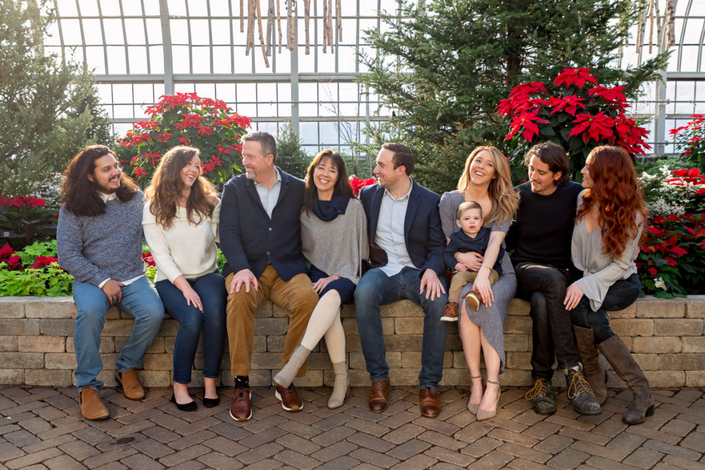 Extended family session for a family with a toddler boy at Garfield Park Conservatory in Chicago on Christmas by family photographer Mila Craila Photography