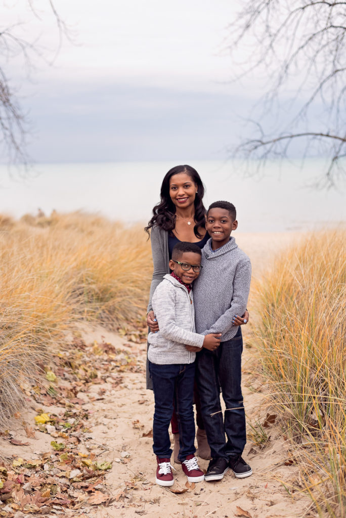 Family session for a family of three on the beach at Gillson Park in Wilmette by family photographer Mila Craila Photography