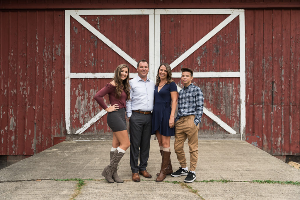 Family session for parents and teenage kids at LeRoy Oakes Forest Preserve in St. Charles in the fall by family photographer Mila Craila Photography