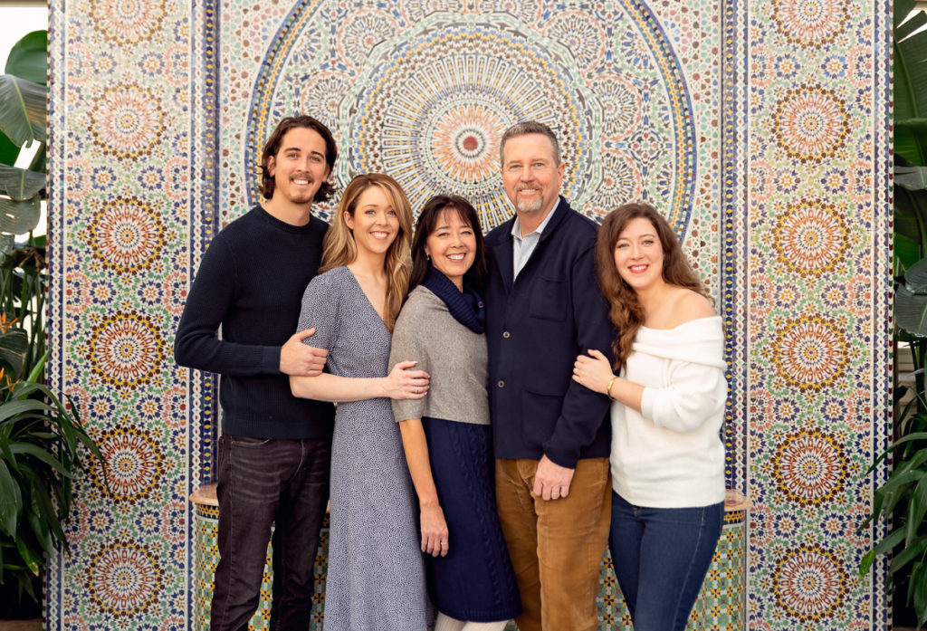 Family session for parents and adult kids at Garfield Park Conservatory in Chicago on Christmas by family photographer Mila Craila Photography