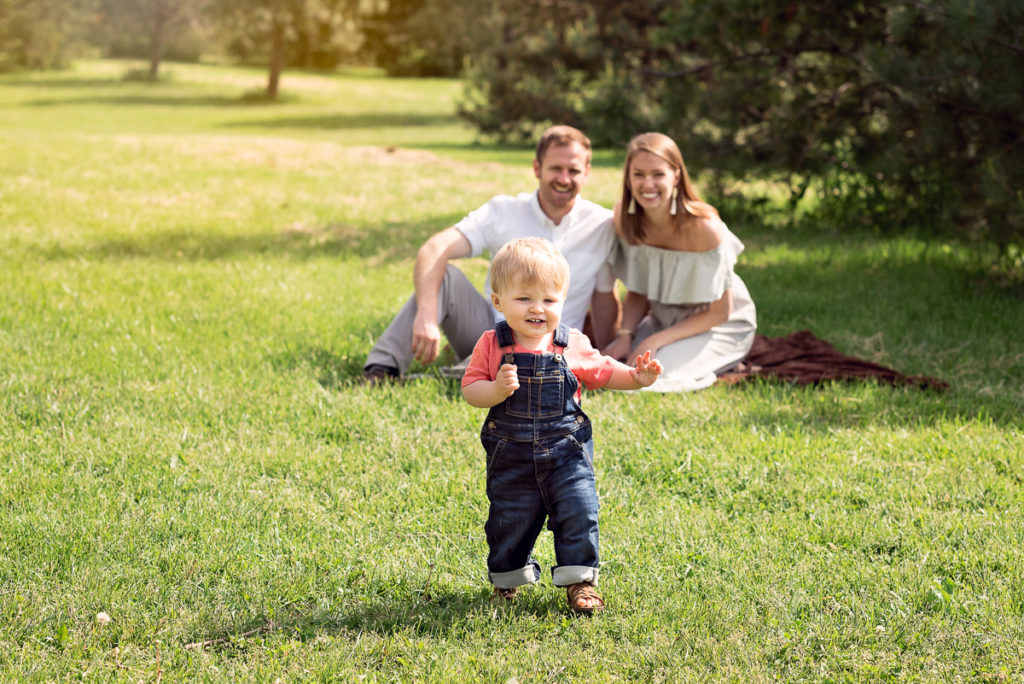 Family session for parents and a toddler son at Montrose Beach in the summer by family photographer Mila Craila Photography