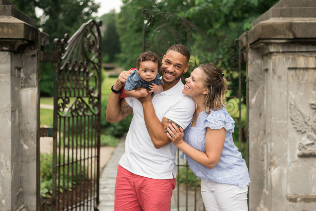 Family session for parents and a toddler son at Fabyan Forest Preserve in Geneva in the summer during rain by family photographer Mila Craila Photography