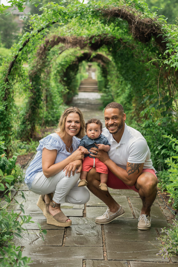 Family session for parents and a toddler son at Fabyan Forest Preserve in Geneva in the summer during rain by family photographer Mila Craila Photography