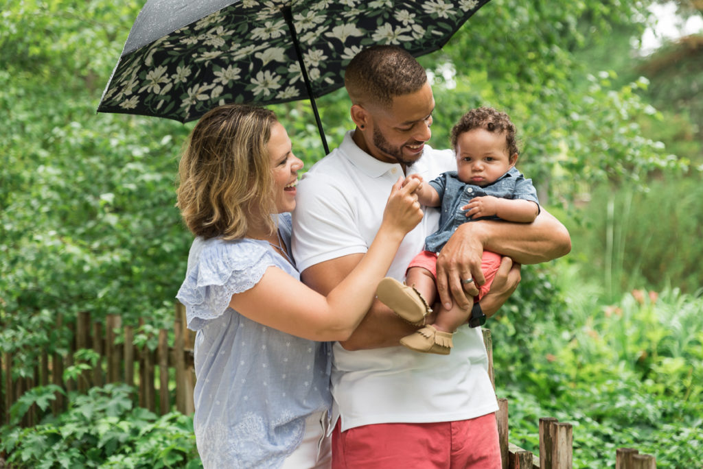 Family session for parents and a toddler son at Fabyan Forest Preserve in Geneva in the summer during rain by family photographer Mila Craila Photography