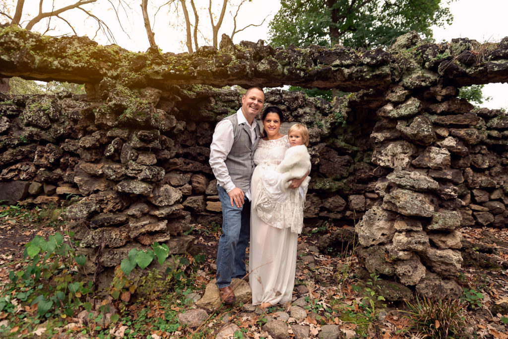 Family session for pregnant parents and a toddler daughter at Fabyan Forest Preserve in Geneva by family photographer Mila Craila Photography