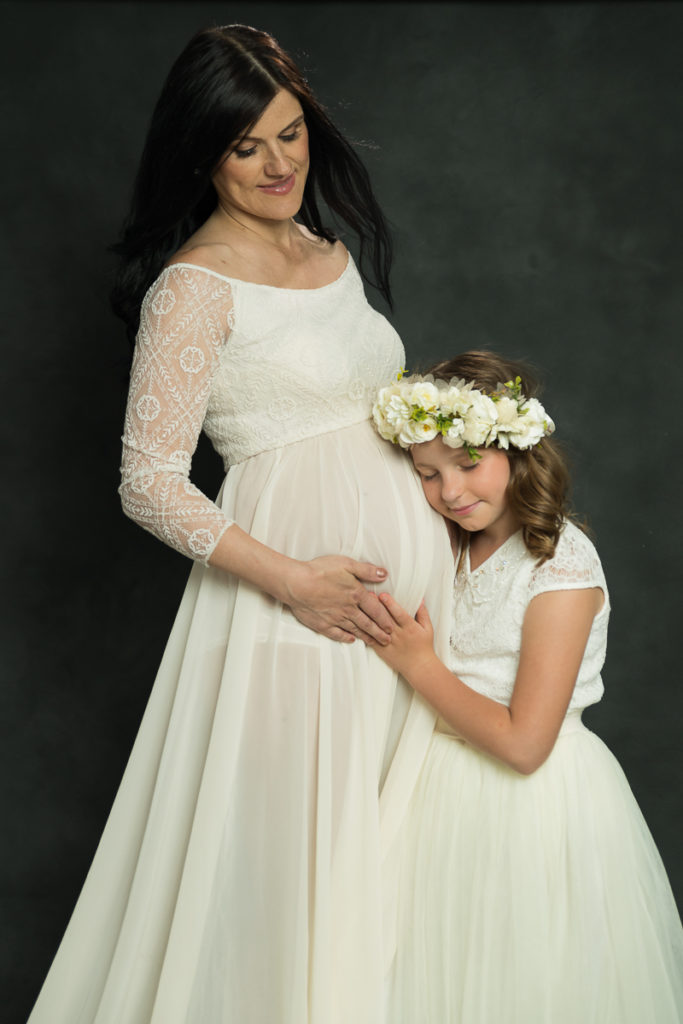 Studio family session for a young girl and her pregnant mother in Naperville by family photographer Mila Craila Photography