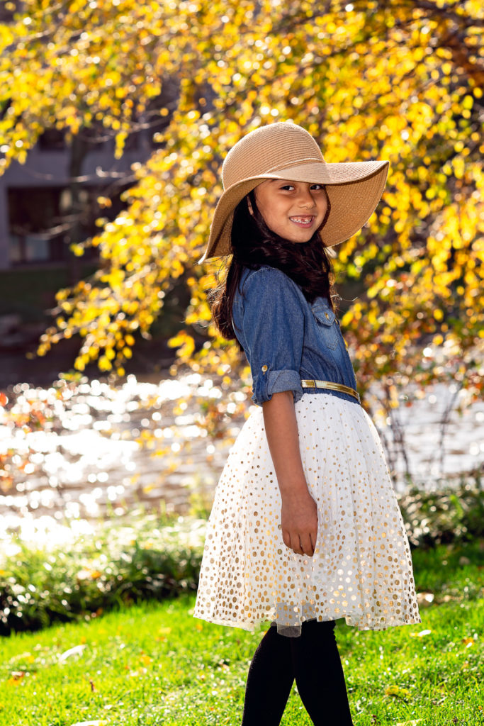 young girl on Naperville Riverwalk in the fall by family photographer Mila Craila Photography