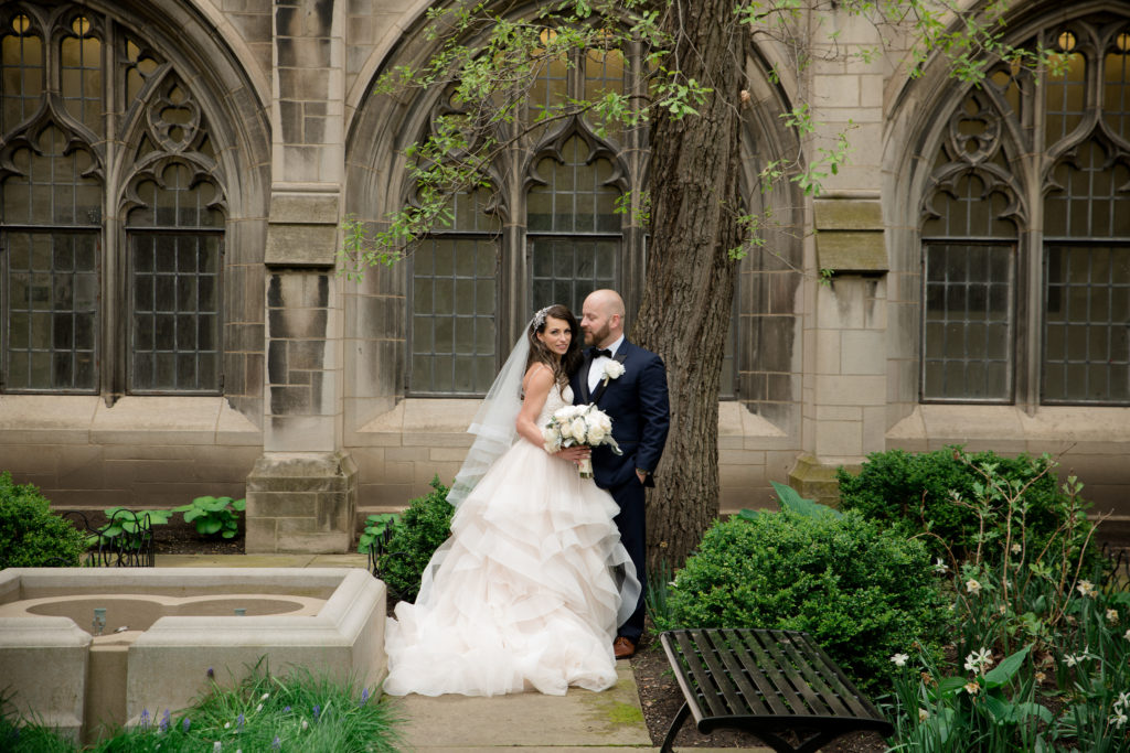 A bride and a groom on their wedding day at University of Chicago by a wedding photographer Mila Craila Photography